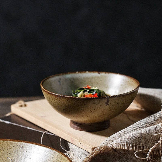 Entertain in classic Japanese style with the Gohobi Handmade Japanese Style Stoneware Bowl. This handmade rice bowl is crafted with traditional skills and materials, infusing a timeless aesthetic to your table. Perfect as a flower bowl or for tea, this exquisite stoneware piece is a beautiful addition to any Japanese tableware collection.