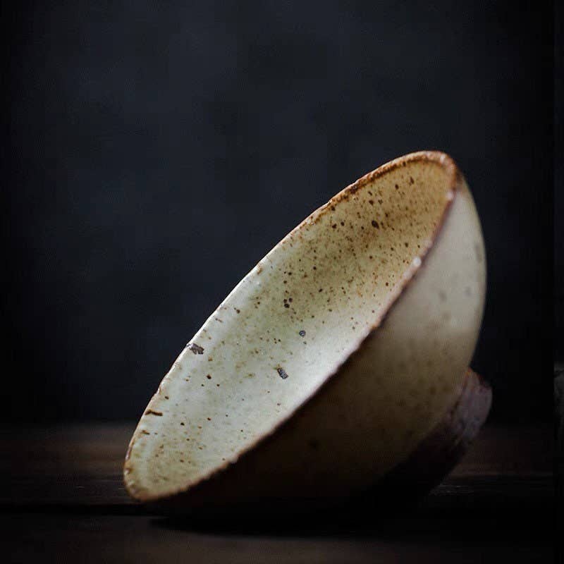 Entertain in classic Japanese style with the Gohobi Handmade Japanese Style Stoneware Bowl. This handmade rice bowl is crafted with traditional skills and materials, infusing a timeless aesthetic to your table. Perfect as a flower bowl or for tea, this exquisite stoneware piece is a beautiful addition to any Japanese tableware collection.